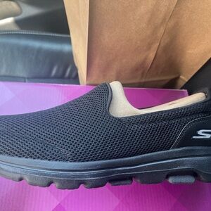 Womans size 8 Wide Skechers slip ons